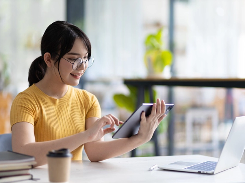 Woman using tablet for screening